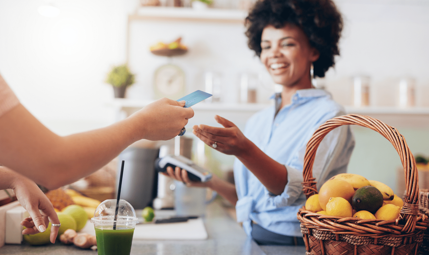 Woman behind a counter accept a card